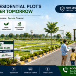 Residential plots with wide roads, marked boundaries, greenery, and modern township infrastructure